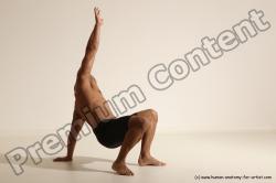 Underwear Gymnastic poses Man Black Muscular Bald Dancing Dynamic poses Academic